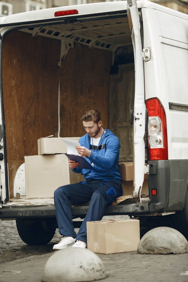 Delivery man with package outdoors